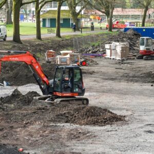 Pontypridd, Wales - April 2021: Small mechanical diggers being used to clear waste ground in Pontypridd.